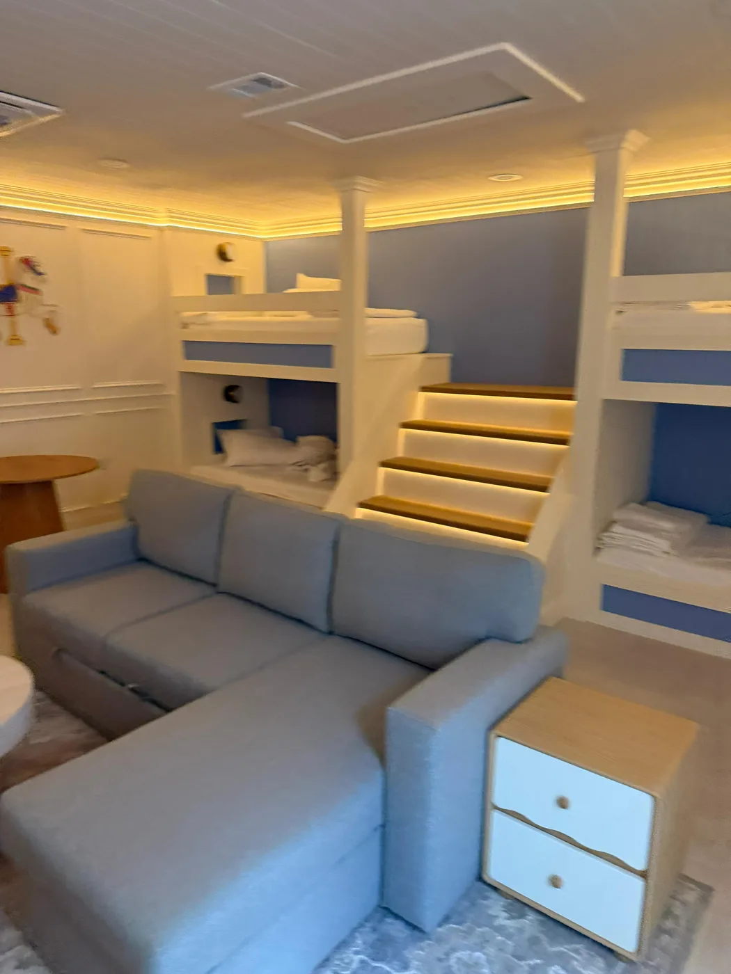 Built-in bunk beds with stairs and lighting