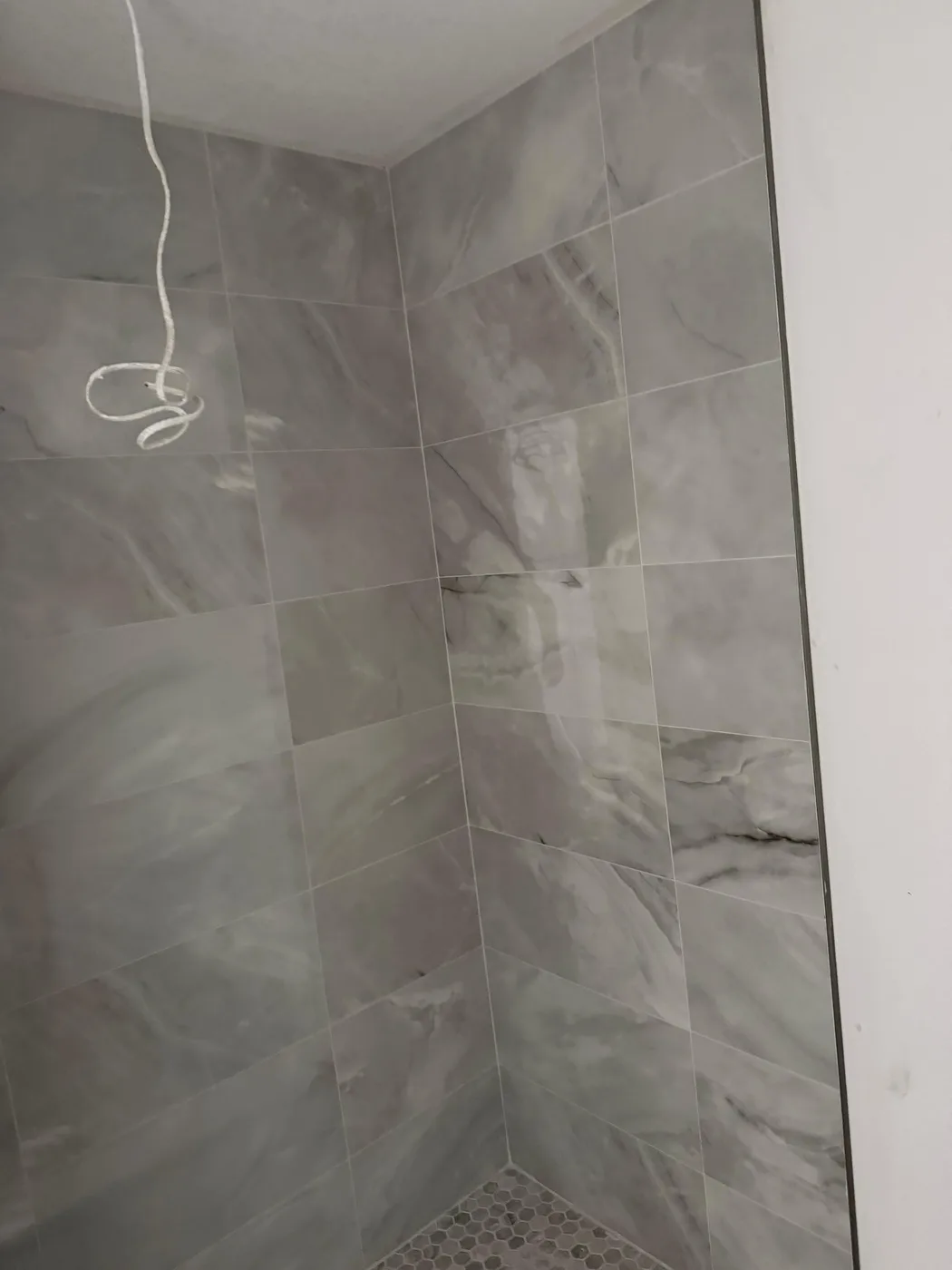 Marble-look tile shower walls we set